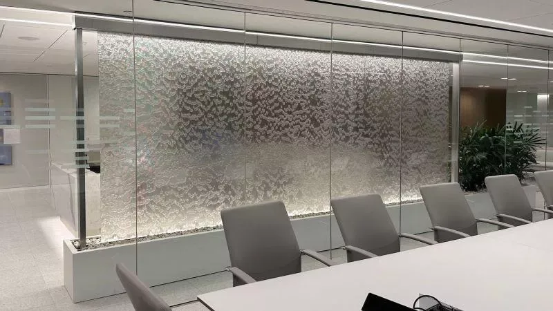 Curved glass facade overlooking a tiered seminar space